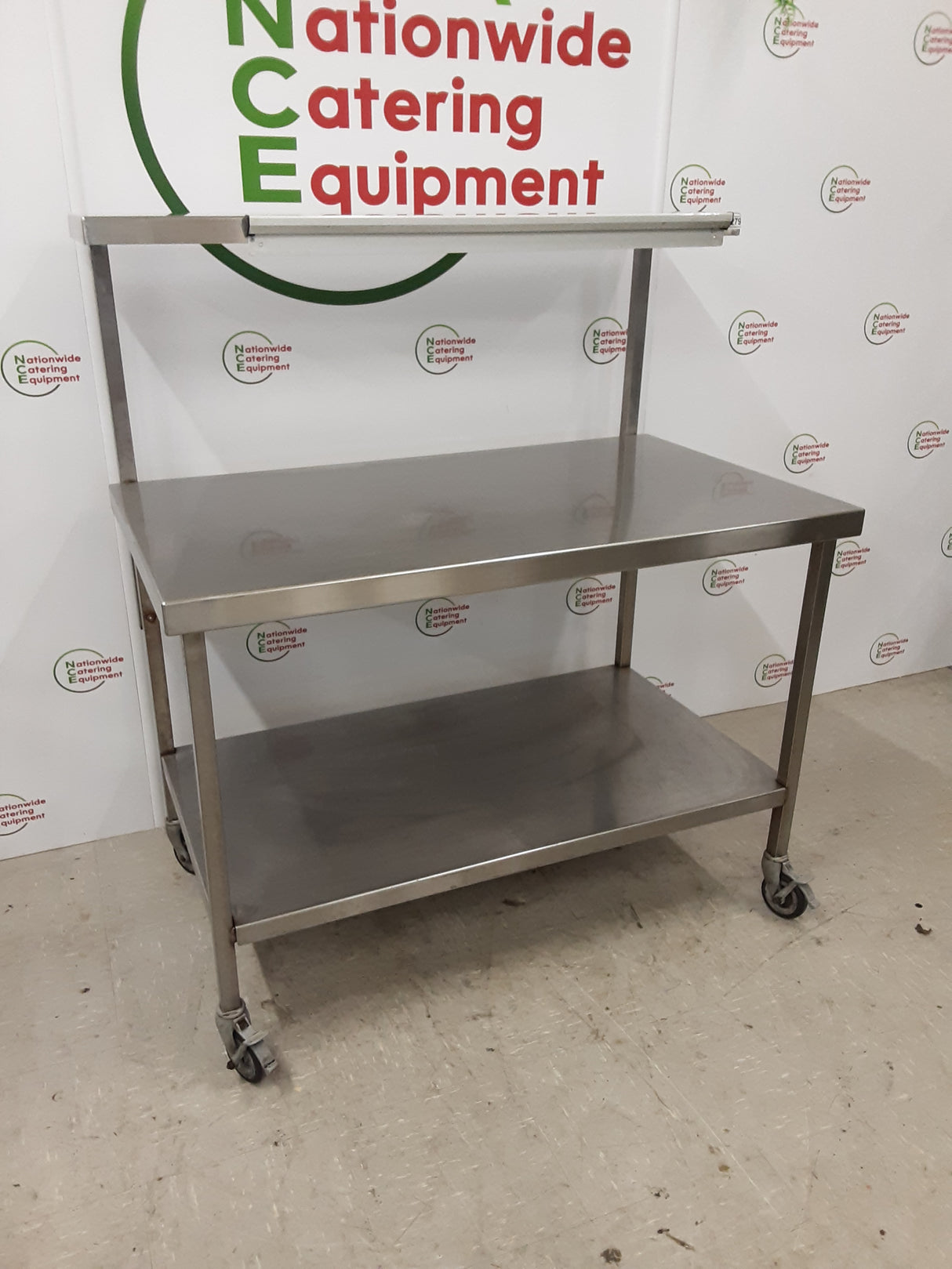 Stainless Steel Table On Wheels &amp; With Shelf Above 120x60cm (NCE6279)